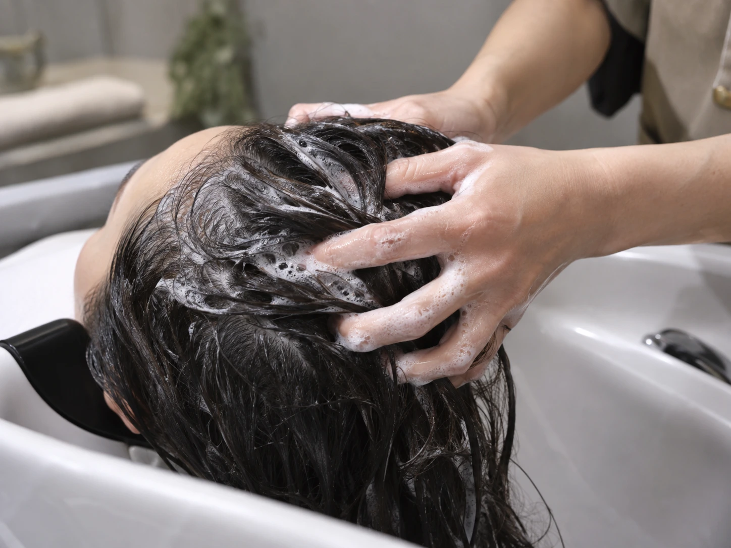 Realistic demonstration of shampoo lather cleansing the scalp and hair